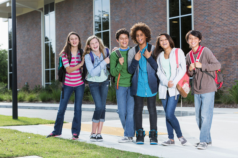 Middle School Students Outside in Front of School