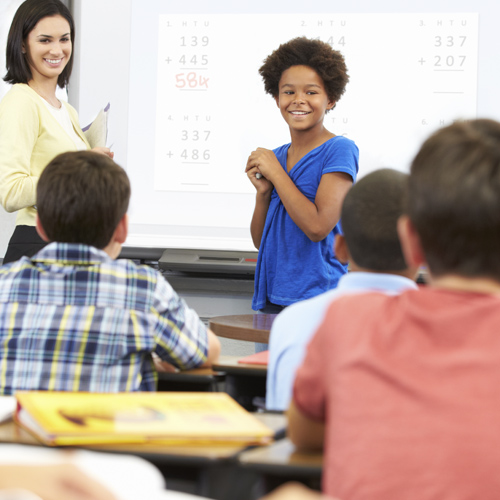 TransMath Student in front of classroom