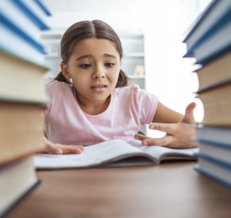 Girl Reading at Desk