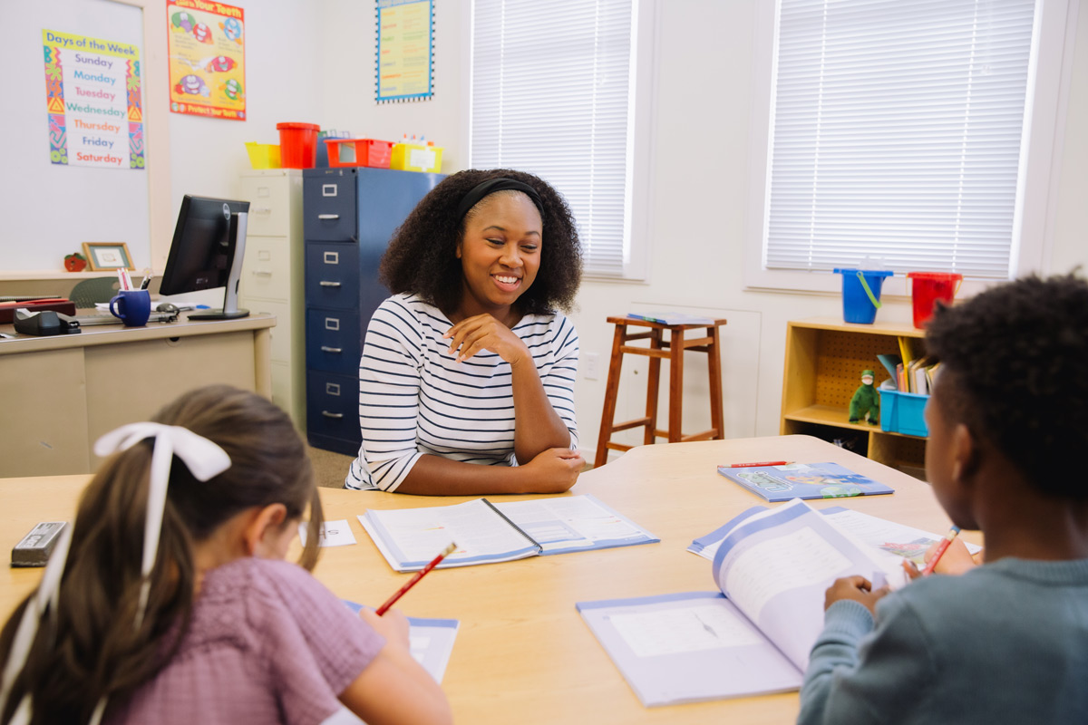 students engaged in a word-sorting or spelling game activity