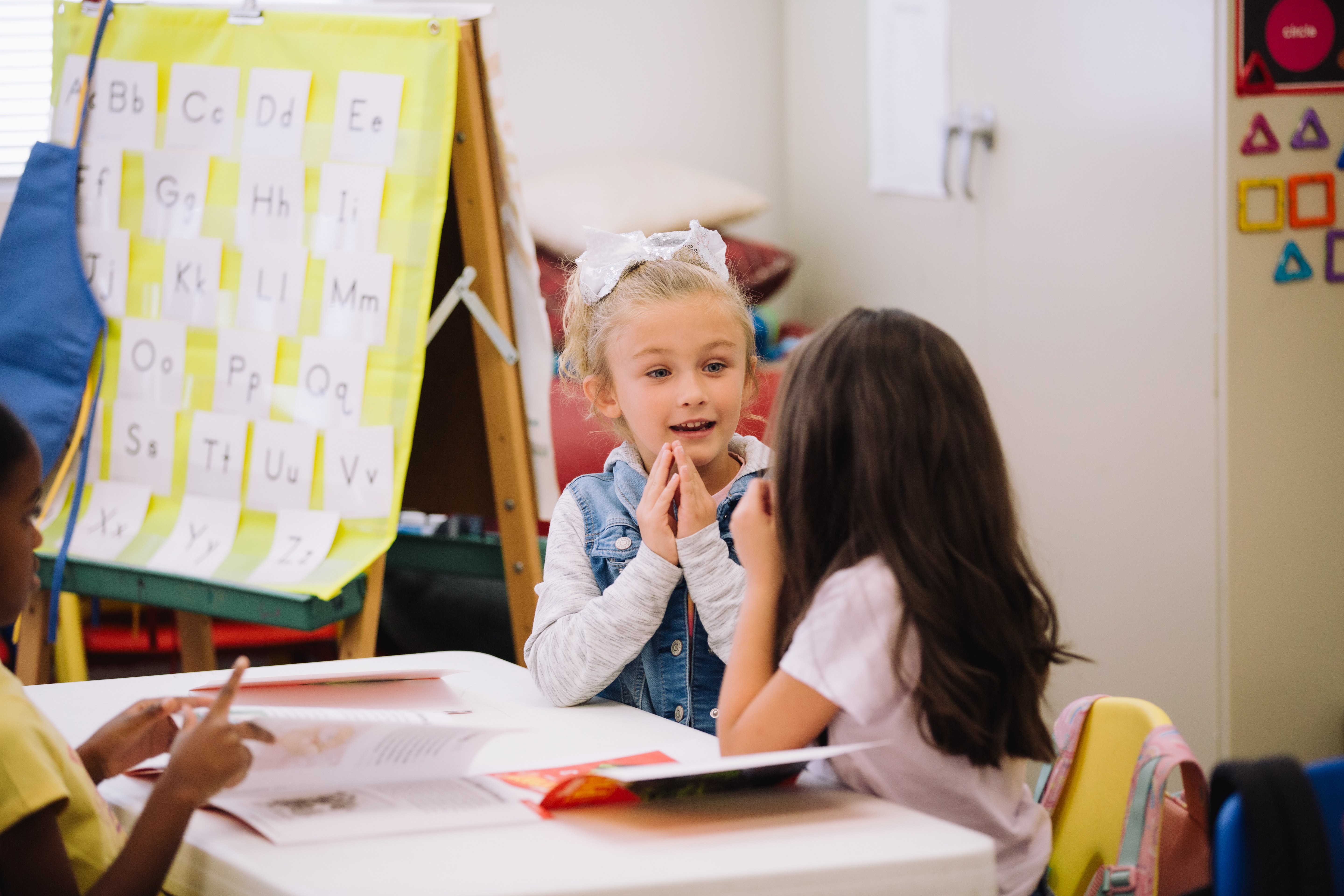 A classroom image showing students using counters, fingers, or another simple manipulative during a sound activity.