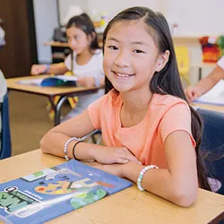 Summer Learning Student Using LINKS to Literacy Book